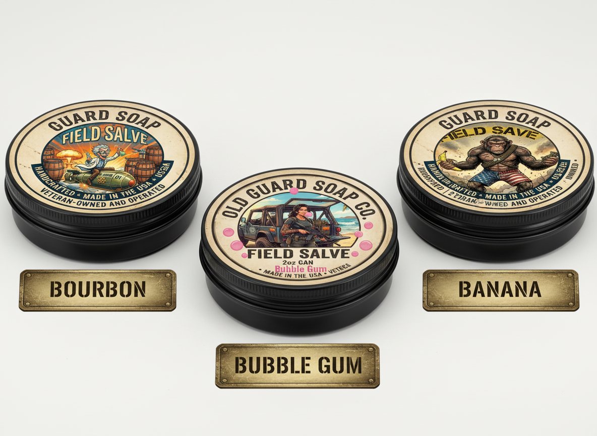Three tins of Old Guard Soap Co. Field Salve with labels for Bourbon, Banana, and Bubble Gum scents on a white background.